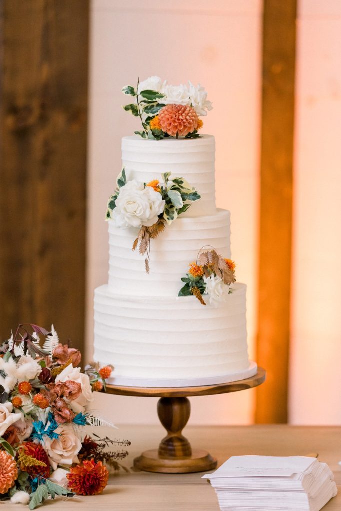 fall white wedding cake with florals